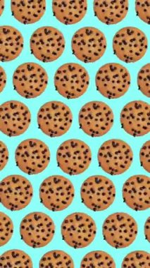 Moda yemek animasyonu, döngülü arka plan veya çikolata damlalı dönen kurabiyelerin sarı arka plan üzerindeki deseni.