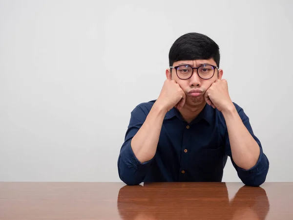 stock image Asian businessman wear glasses sit at the table feels boring