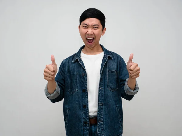 stock image Positive asian man jeans shirt feels happy and show thumb up with successful isolated