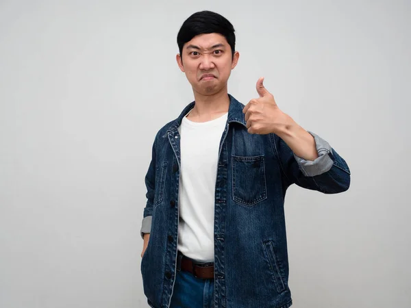 Positive asian man jeans shirt confident show thumb up isolated