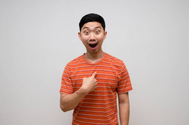 Asian young man striped shirt cheerful point finger at himself choose me concept isolated