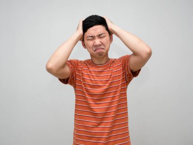 Asian man striped shirt feels headache from hard working isolated