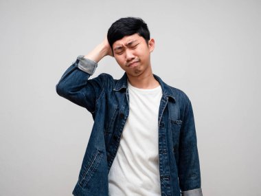 Sadness asian man jeans shirt feels disheartened,cry,headache isolated