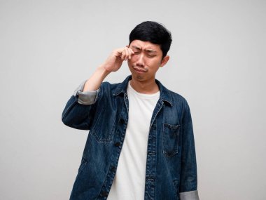Sadness asian man jeans shirt feels disheartened,cry,headache isolated