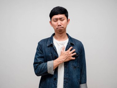 Sadness asian man jeans shirt feels disheartened,cry,headache isolated