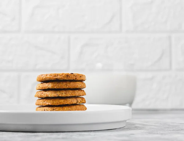 stock image Cookies on a white plate on a light background