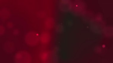 Soyut kırmızı gradyan arkaplan. Odak dışı daireleri ve ince parıltıları var. Şenlik tasarımları, soyut kavramlar, arka planlar ve tatil temalı projeler için harika..
