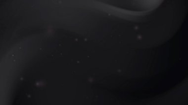 Siyah gri dalgalar hafif hafif ışık lekeleriyle parıldıyor.