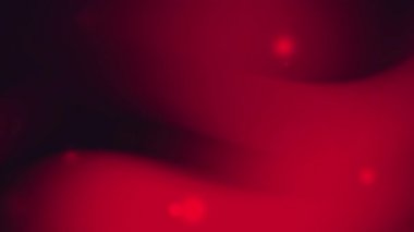 Zarif eğimli kırmızı arkaplan, parlak noktalar ve arka plan için uygun pürüzsüz akış