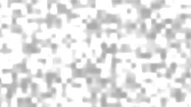 Soyut noktalara benzeyen gri beyaz bulanık şekilleri betimler.