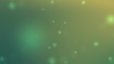 yumuşak eğimli yeşil ve sarı karışımı parlayan bokeh ışıkları Ramazan bayramı etkinlikleri veya dingin tasarım temaları için idealdir maneviyat ve zarafet sergiler.