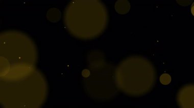 Koyu siyah zemin üzerinde altın bokeh ışık parçacıkları lüks ve zarif sim efekti Noel düğünleri ve premium grafik tasarımları için mükemmeldir.