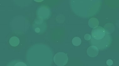 Farklı boyutlarda daireleri olan bulanık yeşil arkaplan