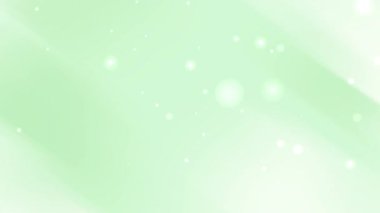 Soyut ışık ışınları ve düğün davetiyesi arkaplanı veya Noel kutlama tasarımı için uygun parıldayan bokeh parçacıkları içeren pastel yeşil arkaplan