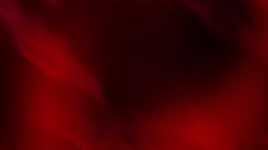 Küresel olay temaları için ideal ışık parçacıkları içeren koyu kırmızı ve siyah renkli soyut duman arka planı Cadılar Bayramı veya sinematik tasarım için gizemli bir ortam gerektiriyor.