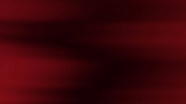 Koyu kırmızı arkaplan ve küçük kırmızı ışıklar.