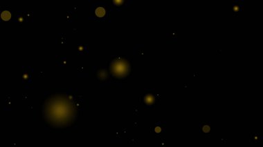 Siyah arkaplanlı Altın Parlayan Parçacık