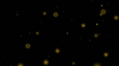 Altın parçacık örtüsü siyah arkaplan üzerinde bulanık sarı daireler oluşturur