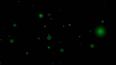 Yeşil parçacık örtüsü siyah şeffaf arkaplan üzerinde büyüleyici bir çember alanı oluşturur