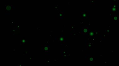 Yeşil daireli siyah bir arkaplan üzerinde yeşil parçacık