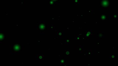 Siyah arkaplanda yeşil parçacık