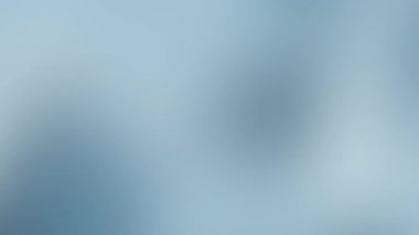 Küresel barış kutlaması dijital tasarım markalaşması ve lüks modern sunum arkaplanı için ideal yumuşak soyut bulanık hareket ile açık mavi gradyan animasyon arka planı