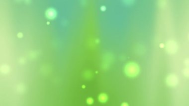 yeşil ve mavi renklerin ve parlayan ışık parçacıklarının karışımından oluşan soyut bir arka plan doğa teması için idealdir. Çevre dostu tasarımlar, refah kavramları ve Dünya Günü kutlamaları.