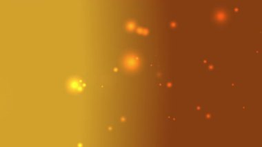 Soyut parçacıklar ve yumuşak bokeh ışıkları ile altın gradyan arka plan Noel Diwali Yeni Yılı ya da sıcak ve lüks bir his gerektiren zarif tasarımlar gibi şenlik temaları için idealdir.