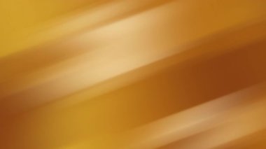 Çapraz hareket bulanıklığı ve düzgün gradyan ışıklandırması olan altın soyut arkaplan. Sıcak ve lüks tonlarda modern ve zarif görünüm yaratıyor. Bayram teması posterleri ve markalaşma tasarımı için mükemmel.