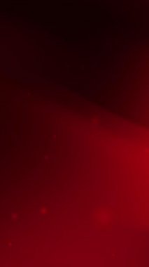 Yumuşak parlak parçacıklar ve ince gradyan ile koyu kırmızı dikey arka plan sosyal medya markalaştırma dijital pazarlama temaları ve Noel ya da Sevgililer Günü gibi şenlikli tasarımlar için mükemmeldir.