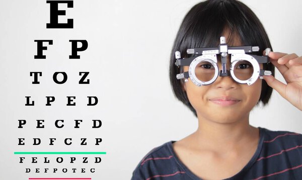Kid eye test in hospital, child eye exam 
