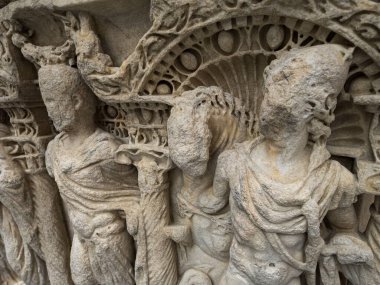 Italy Florence December 14 2015 A detailed close-up of ancient stone relief sculptures displayed at the Museo dellOpera del Duomo in Florence, Italy. The intricate craftsmanship showcases historical clipart