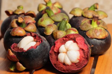 Purple mangosteen fruit with delicious core. Cancer prevention fruits clipart