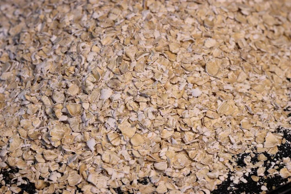 Rolled oats background. Organic diet cereal healthy food. Rolled oats close up image. Macro photo