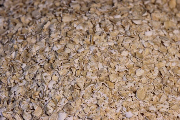Rolled oats background. Organic diet cereal healthy food. Rolled oats close up image. Macro photo