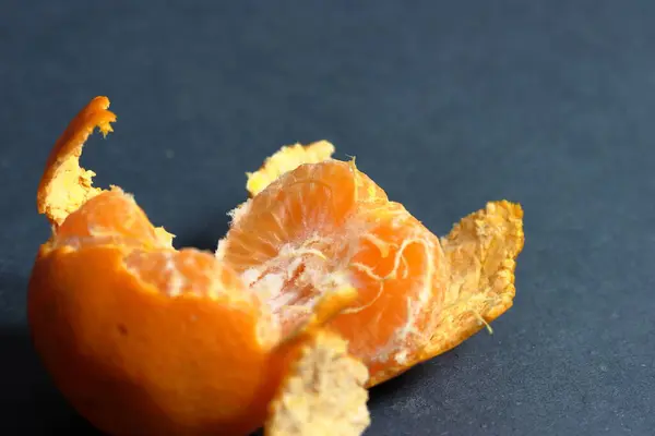 Orange peeled skin on a texture background
