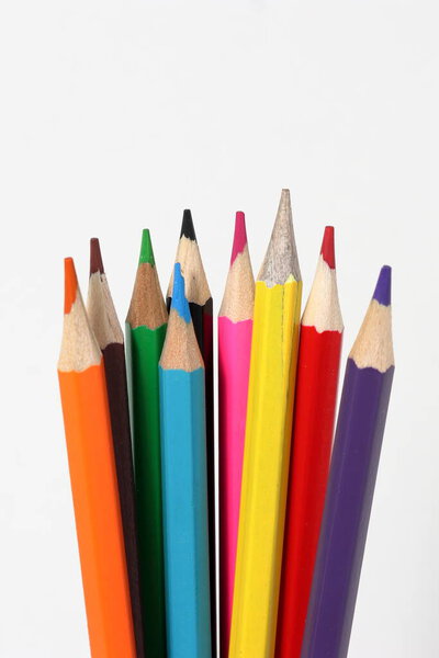Color pencils standing on white background. close up of colored pencils