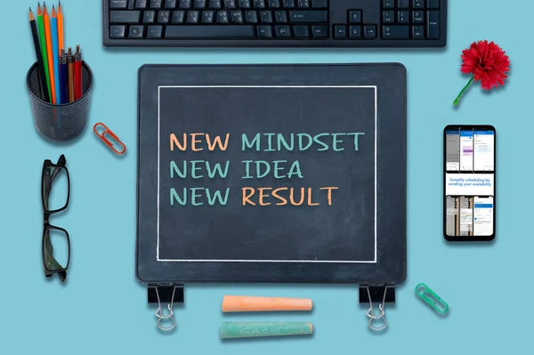 New mindset new results concepts with text on Blackboard. positive thinking and motivation of business