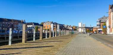 Geraardsbergen town centre, pavement quay and pavement near the river Dender. clipart