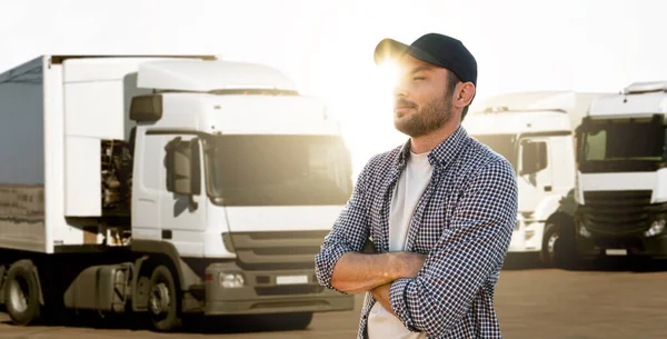 stock image Truck driver standing in front of trucks 