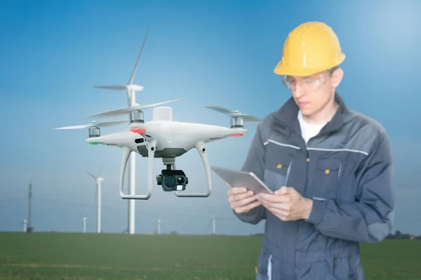 Engineer Tablet Computer Controls Drone Background Wind Turbines — Stock Photo, Image