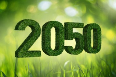 Numbers 2050 from grass. A symbol of sustainable development and full transition to renewable energy by 2050 year. clipart