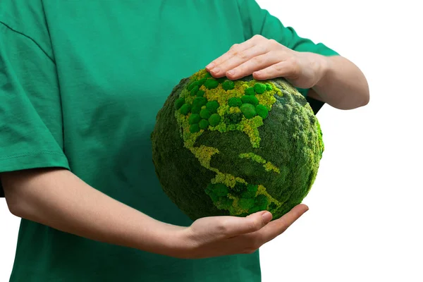 Woman holds a green planet Earth. Symbol of sustainable development and renewable energy