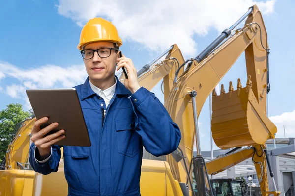 Engineer Helmet Digital Tablet Phone Background Construction Machines —  Fotos de Stock