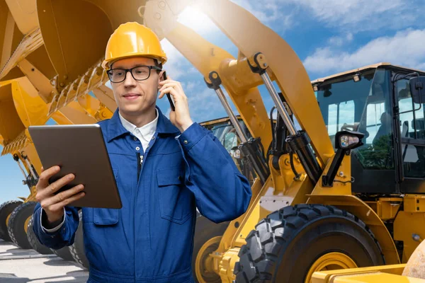 Engineer Helmet Digital Tablet Phone Background Construction Machines — Stok fotoğraf