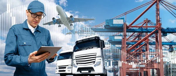 Manager with a digital tablet on a background of a ship in the seaport, airplane and trucks. International trade and logistics concept.