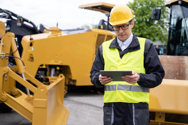 Engineer Digital Tablet Next Road Construction Machine — Stock Photo, Image