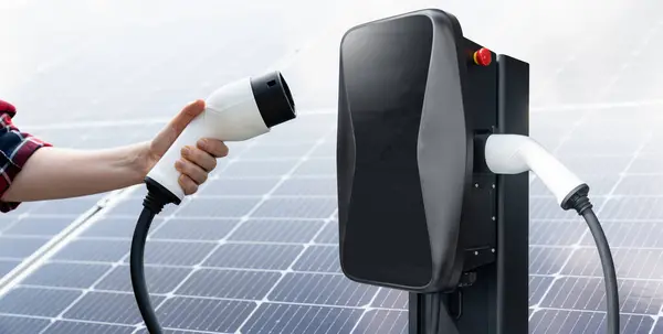Hand Electric Vehicles Charging Plug Background Solar Panel — Stock Photo, Image