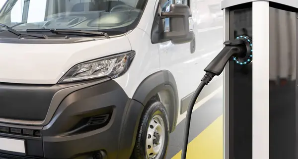 Electric delivery van with electric vehicles charging station.