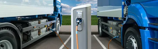 stock image Electric trucks batteries are charged from the charging station. Concept..